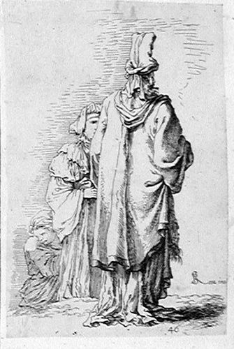 Ein Orientale mit Turban vom Hinten mit zwei Frauen